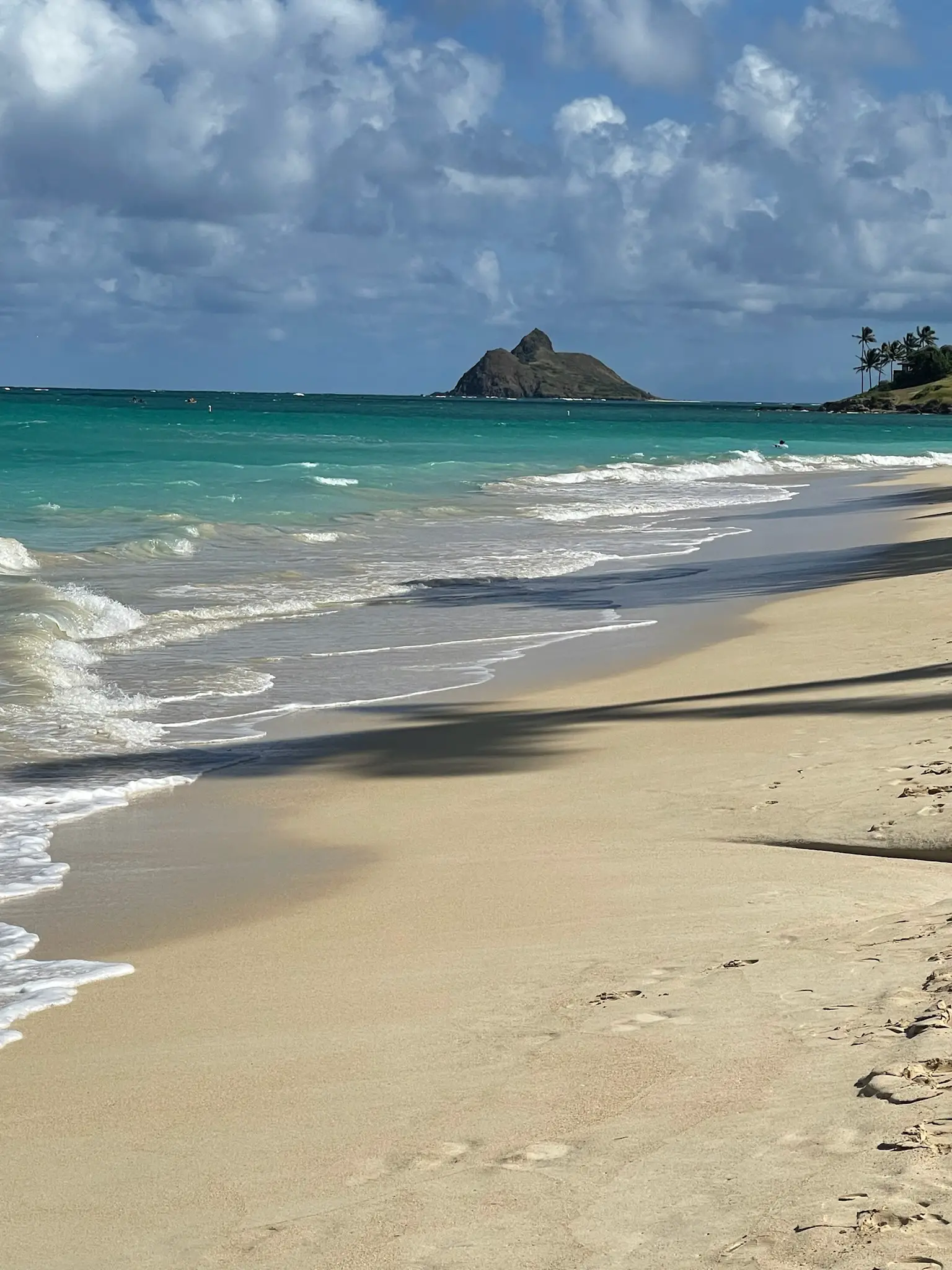 Photograph of Oahu beach with "Chinaman's Hat" rock formation